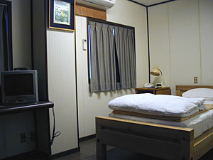 ビジネスホテル・ケアンズの客室の写真