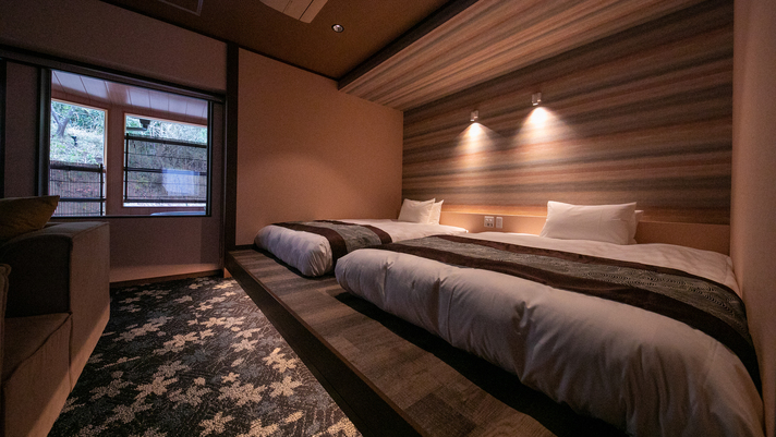 【水の音】特別室のベッドはシモンズ製のダブルベッドです。