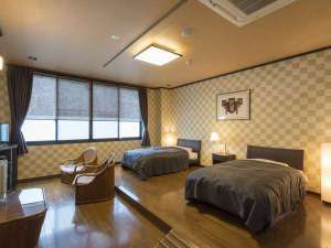 和洋室ツインベッド（洋室15畳+和室8畳）